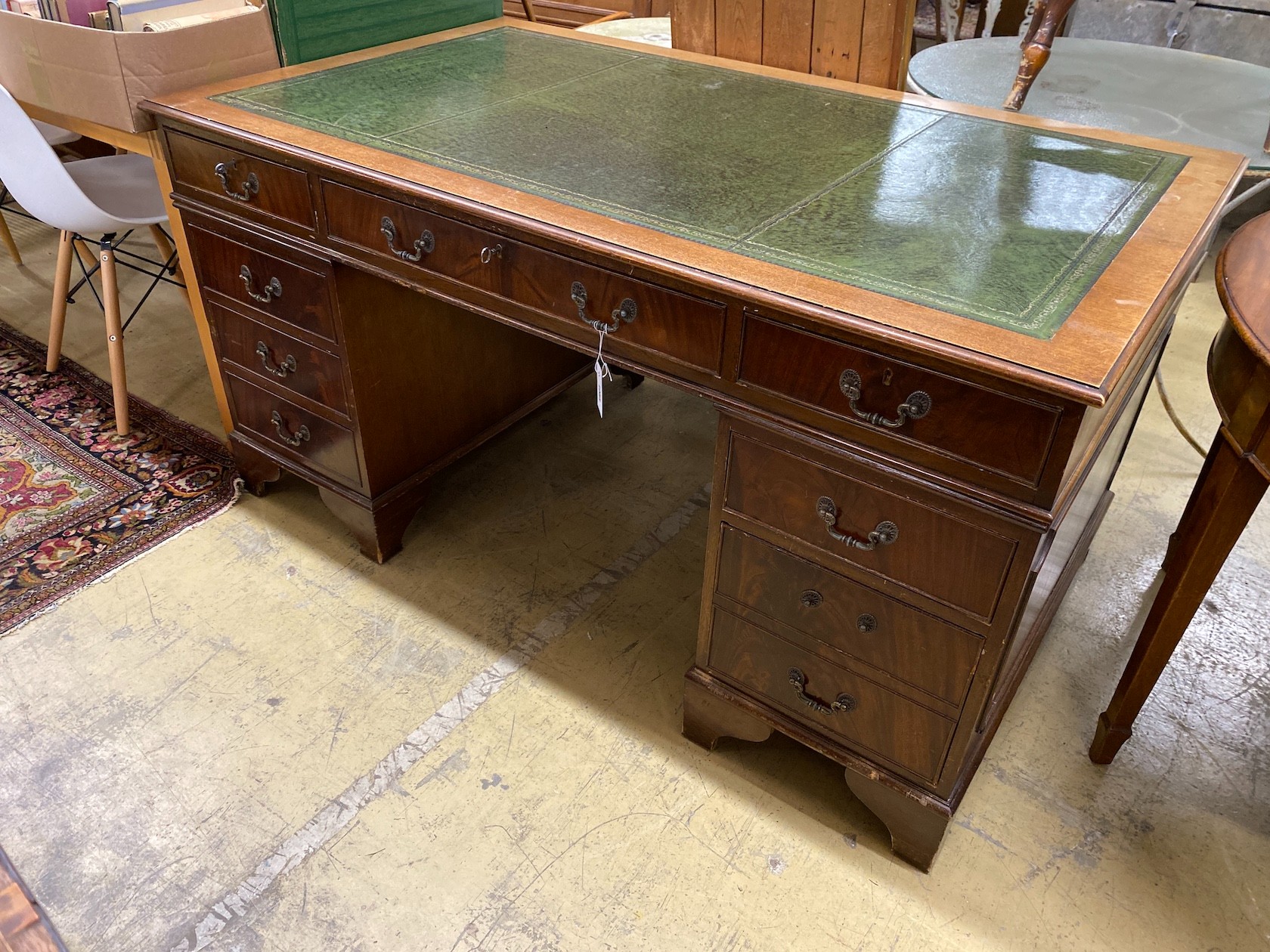 A reproduction George III style mahogany pedestal desk, length 152cm, depth 90cm, height 79cm